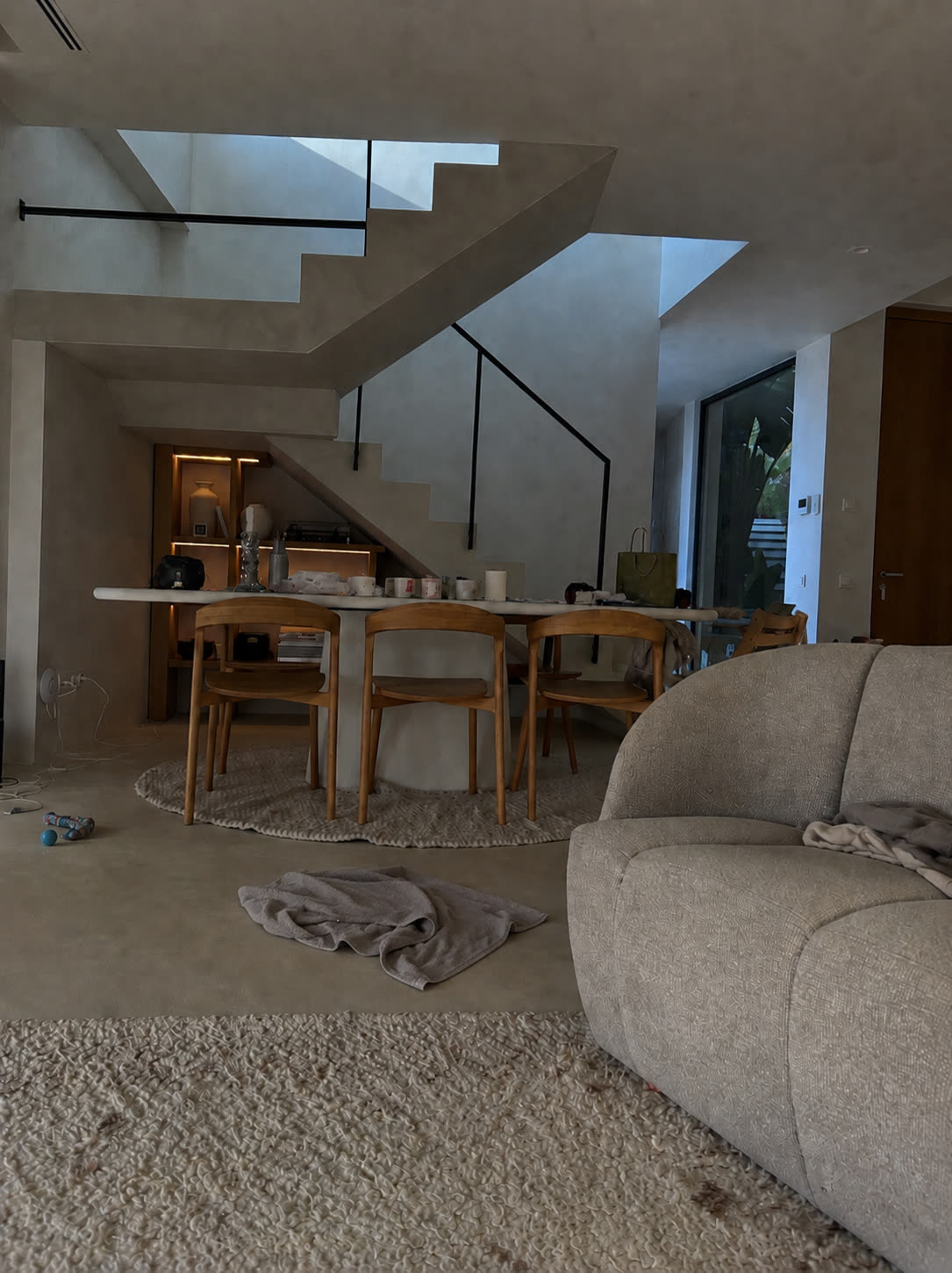 A room shot on a phone — dim, flat and cluttered